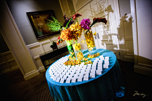 The guests were greeted with a place card table arrangement with multiple 